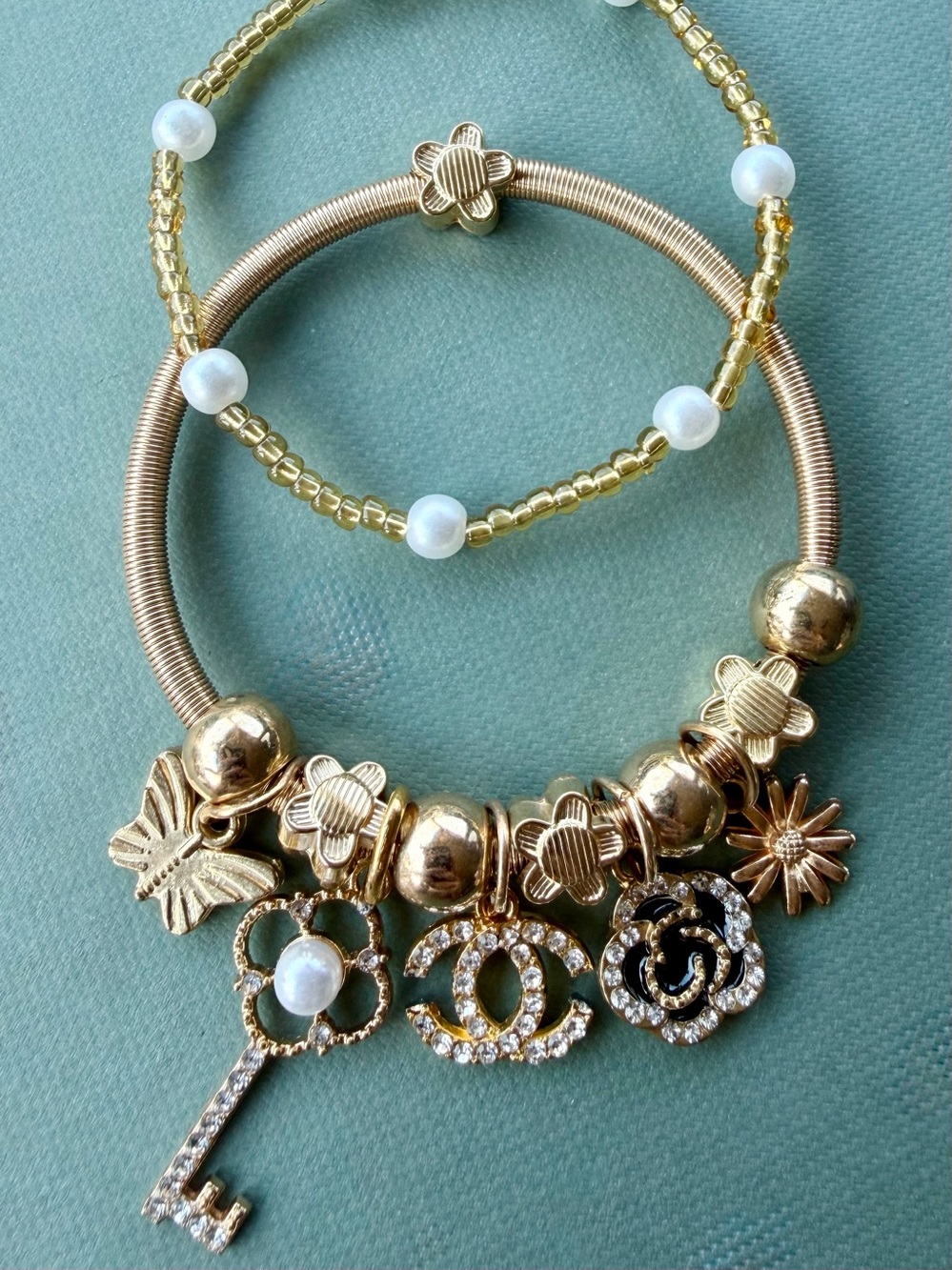 CC Gold-Tone Charm Bracelet with Pearl Accent Elastic bracelet